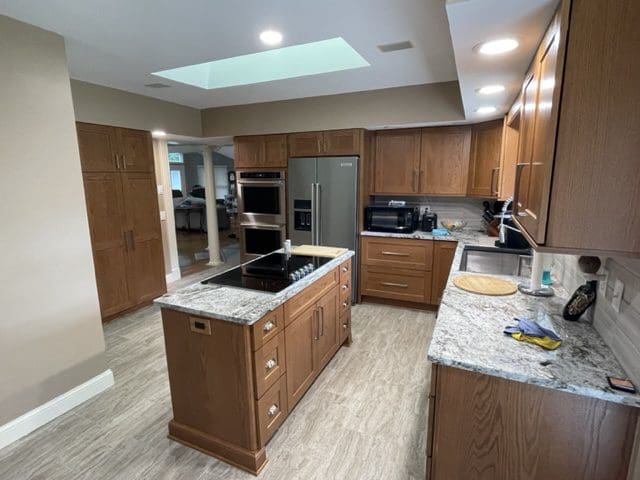 A remodeled kitchen featuring a kitchen soffit that runs along the perimeter of the kitchen.