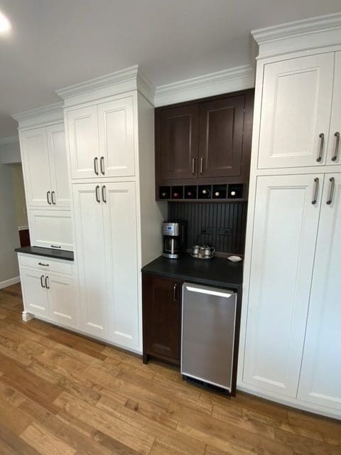 Custom cabinetry with start molding applied between the wall cabinetry and the crown molding.